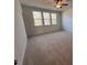 Bright bedroom with carpeted floors and large windows at 8946 Kennebec Crossing Dr # 79, Angier, NC 27501