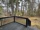 Private backyard with deck and mature trees at 905 Corona St, Durham, NC 27707