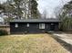 Newly renovated black brick ranch home with a spacious yard at 905 Corona St, Durham, NC 27707
