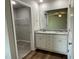 Bathroom with double vanity, granite countertop, and walk-in closet at 93 Faucette Dr, Selma, NC 27576