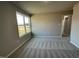Bright bedroom with large window and neutral color palette at 93 Faucette Dr, Selma, NC 27576