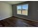 Cozy bedroom with large window and neutral-colored flooring at 93 Faucette Dr, Selma, NC 27576