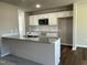 Modern kitchen featuring white cabinets, granite countertops, and stainless steel appliances at 93 Faucette Dr, Selma, NC 27576