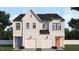 Stunning duplex featuring white siding, black roof, white garage doors, and colorful front doors at 935 Selby Ave, Durham, NC 27713