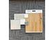 Image displays a selection of interior finishes including floorboards, tile and paint samples at 935 Selby Ave, Durham, NC 27713