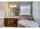 Spa-like bathroom with soaking tub and walk-in shower at 1016 Dozier Way, Cary, NC 27518