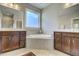 Double vanity bathroom with a large soaking tub at 1016 Dozier Way, Cary, NC 27518