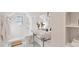 Modern bathroom with white subway tile and a pedestal sink at 103 W Delafield Ave, Durham, NC 27704