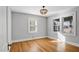 Bright bedroom with hardwood floors and large windows at 103 W Delafield Ave, Durham, NC 27704