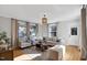 Spacious living room with hardwood floors, a beamed ceiling, and ample natural light at 103 W Delafield Ave, Durham, NC 27704