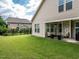 Spacious backyard featuring a covered patio perfect for outdoor entertaining and relaxation at 13 Needham Ln, Clayton, NC 27527