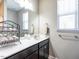 Bathroom with a vanity, mirror, and plenty of counter space at 13 Needham Ln, Clayton, NC 27527
