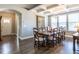 Elegant dining room featuring hardwood floors, a coffered ceiling, and large windows at 13 Needham Ln, Clayton, NC 27527