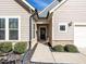 Welcoming front entrance with stone accents and a charming wreath at 13 Needham Ln, Clayton, NC 27527