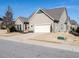 House exterior with attached garage and landscaping at 13 Needham Ln, Clayton, NC 27527