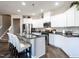 Well-equipped kitchen featuring an island, granite countertops, and stainless steel appliances at 13 Needham Ln, Clayton, NC 27527