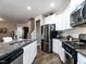 Spacious kitchen with stainless steel appliances and an island with seating at 13 Needham Ln, Clayton, NC 27527