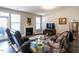 Living room features fireplace, hardwood floors, and comfy seating at 13 Needham Ln, Clayton, NC 27527