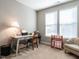 Home office with desk, chair, and ample natural light at 13 Needham Ln, Clayton, NC 27527