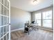 Bright office with built-in shelving and a spacious desk at 13 Needham Ln, Clayton, NC 27527
