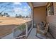 Front porch with rocking chairs and a view of the yard at 1424 Old Watkins Rd, Raleigh, NC 27616