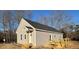 Newly built home showcasing rear view, deck, and surrounding landscape at 170 Squirrel Path Way, Roxboro, NC 27574