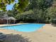 Inviting community pool with lounge chairs at 1801 Trailwood Heights Ln # 201, Raleigh, NC 27603