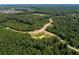 Aerial view of community with roads and lush green forest at 20 Lila Dr, Pittsboro, NC 27312