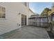 Exterior view of home's patio area with slider access and hose at 2031 Rivergate Rd # 105, Raleigh, NC 27614