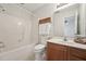 Bright bathroom with a shower-tub combination, vanity, and updated fixtures at 2031 Rivergate Rd # 105, Raleigh, NC 27614