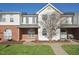 Charming townhome featuring a well-maintained lawn, brick accents, and inviting curb appeal at 2031 Rivergate Rd # 105, Raleigh, NC 27614