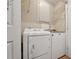 Convenient laundry room with a washer, dryer, and wire shelving at 2031 Rivergate Rd # 105, Raleigh, NC 27614