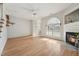 Spacious living room with fireplace, hardwood floors, and arched window for ample natural light at 2031 Rivergate Rd # 105, Raleigh, NC 27614