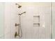 Walk-in shower with double shower heads and decorative tile insets at 206 Ellington Lot 7 Rd, Graham, NC 27253