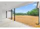 View from the covered patio to the large, unfinished backyard at 250 Ellington Rd, Graham, NC 27253