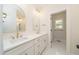 Bathroom vanity with double sinks, white countertop, and gold hardware at 250 Ellington Rd, Graham, NC 27253