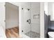 Modern bathroom features a glass enclosed shower with pebble tile floor at 250 Ellington Rd, Graham, NC 27253