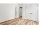 Bedroom features wood flooring and access to a closet and additional room at 250 Ellington Rd, Graham, NC 27253
