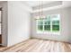 Dining room with natural light, chandelier, and hardwood floors at 250 Ellington Rd, Graham, NC 27253