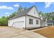 Modern farmhouse-style home with a spacious driveway leading to an attached two-car garage at 250 Ellington Rd, Graham, NC 27253