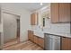 Kitchen featuring wood cabinets, subway tile backsplash, stainless steel appliances, and hardwood floors at 250 Ellington Rd, Graham, NC 27253