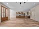 Bright kitchen with stainless appliances, wood-style floors, and modern lighting fixtures at 250 Ellington Rd, Graham, NC 27253