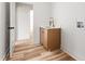 Laundry room boasts a white countertop, wood cabinets and modern brass faucet at 250 Ellington Rd, Graham, NC 27253