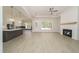 Bright living room features a fireplace, recessed lighting, and large windows that let in natural light at 250 Ellington Rd, Graham, NC 27253