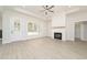 Bright living room features a fireplace, recessed lighting, and large windows that let in natural light at 250 Ellington Rd, Graham, NC 27253