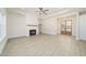 Bright living room features a fireplace, recessed lighting, and double french doors that lead to entry at 250 Ellington Rd, Graham, NC 27253