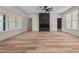 Spacious living room features modern fireplace, ceiling fan and large windows at 250 Ellington Rd, Graham, NC 27253