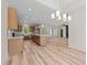 Open concept living space with wood floors connecting the kitchen, dining area, and living room at 250 Ellington Rd, Graham, NC 27253