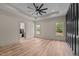 Bright main bedroom with hardwood floors and large windows at 250 Ellington Rd, Graham, NC 27253
