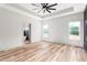 Main bedroom with natural light, fan, hardwood floors, and closet at 250 Ellington Rd, Graham, NC 27253